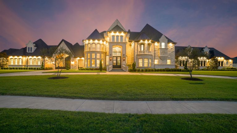 Warm lit suburban home at dusk in Middle Tennessee