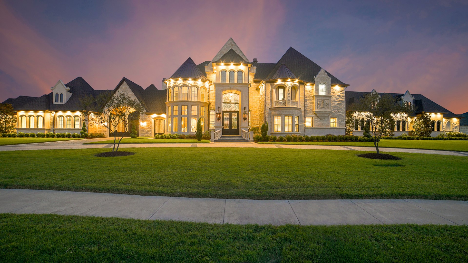 Warm lit suburban home at dusk in Middle Tennessee